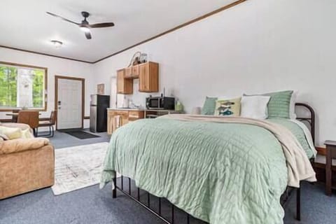 The Studio offers a kitchenette, queen bed, queen sofa sleeper, table and chairs.