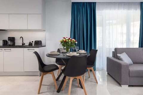 Large table with chairs for eating communal meals.