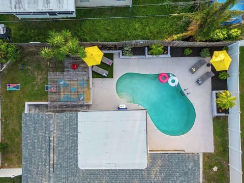 (POOL) Unwind in your private backyard oasis with a fenced-in pool, featuring cozy loungers and fun floaties for the perfect relaxation experience. For families, kids life vests are provided, so everyone can enjoy and have fun time in the water.