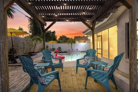 (BACKYARD) The outdoor deck offers a welcoming space to relax in comfortable chairs while enjoying games like cornhole or ladder toss. With hamburgers sizzling on the grill, it’s the perfect spot for socializing and indulging in the pool.