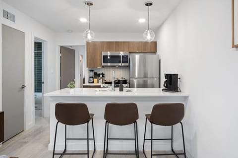 Set the table for memorable meals in this beautifully arranged dining area. With elegant place settings and a charming centerpiece, it's perfect for hosting dinner parties or enjoying family dinners in a cozy and stylish atmosphere.