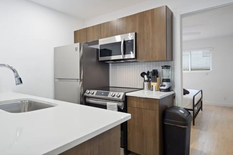 The kitchen invites you to experiment with new recipes, offering a stylish and practical space to cook and create.