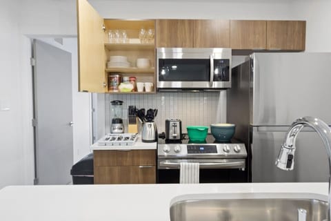 You’ll love the convenience of this fully equipped kitchen, where you can brew coffee, cook meals, or prepare snacks. The cozy layout and warm ambiance make cooking here a delightful part of your stay.