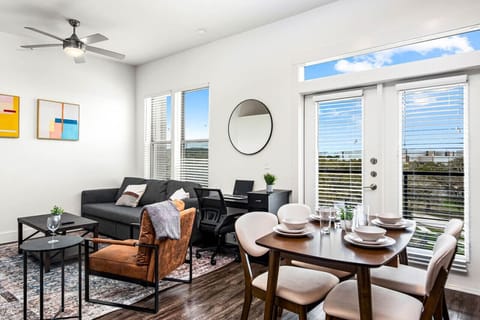 The living room is filled with natural light, creating a bright and welcoming space that invites relaxation.