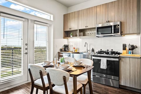 The dining room is bathed in natural light, creating a bright and inviting space where every meal feels special.