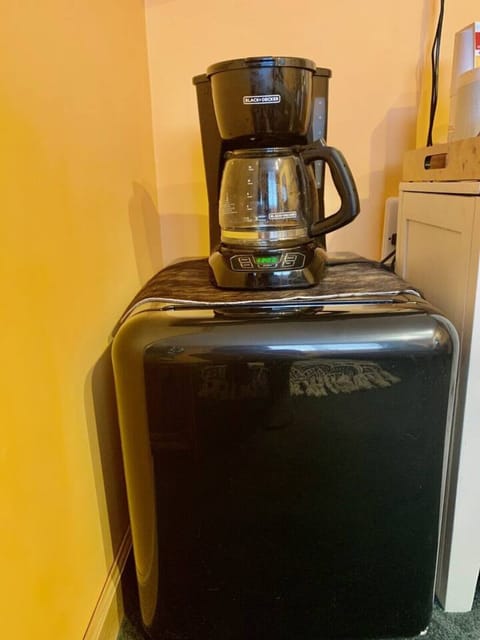 Chill your cold items in the hotel style refrigerator and brew fresh coffee.