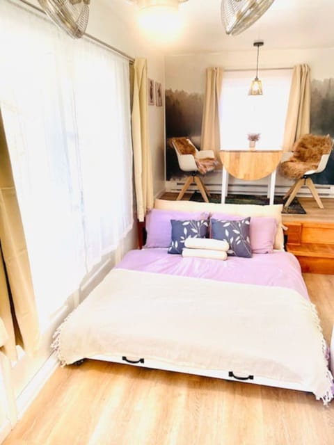 The bed becomes a couch during the day. It can be moved under the dining platform.