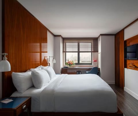 Unwind in crisp linens beside warm wood-paneled elegance.