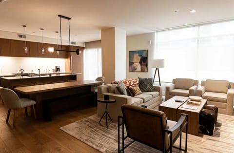 Open-concept living and dining area with sophisticated decor