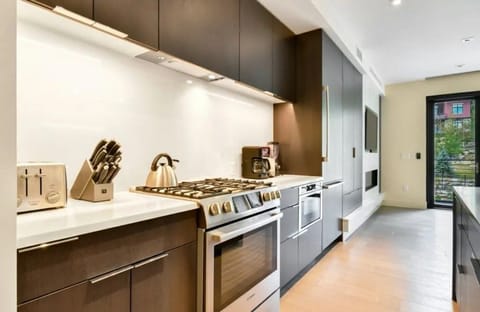 Modern kitchen with sleek cabinetry and high-end appliances