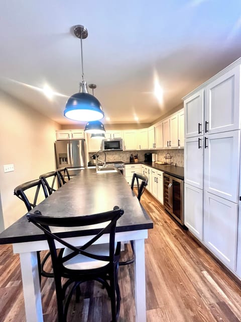 Large updated kitchen with gas stove, beverage cooler and high-end appliances. 