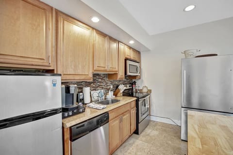 A well-appointed full kitchen in the two-story loft, offering a complete set of appliances