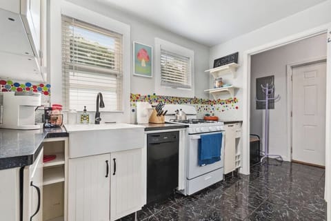 Beautiful, sunny fully stocked kitchen.