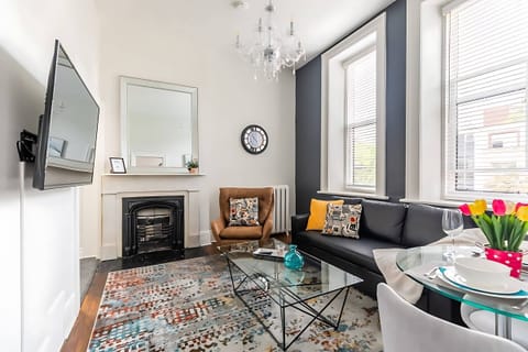 Bright Living Area With Elegant Details And A Cozy Fireplace