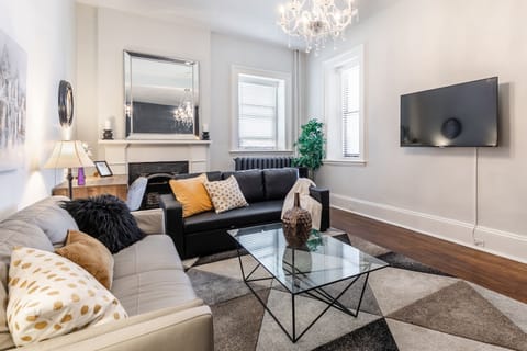 Spacious Living Room With Smart TV And Cozy Fireplace
