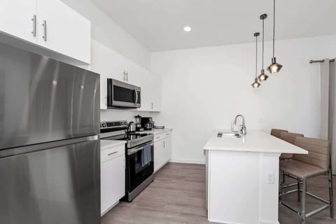 Cook up a storm in the fully equipped kitchen with modern appliances and all the essentials you need.