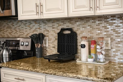 Breakfast perfection awaits: Whip up delicious waffles with our fully stocked waffle maker station