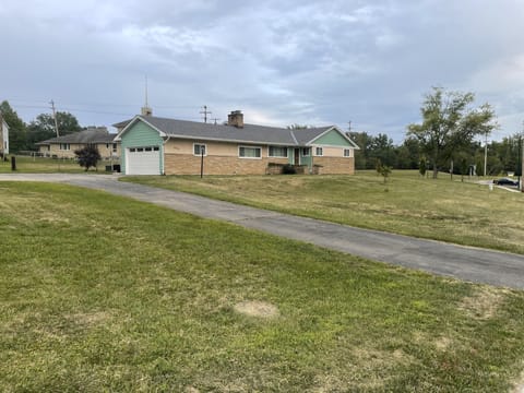 Street view of home.  Large driveway to accommodate multiple vehicles+garage.