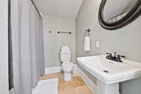 The bathroom is located off the secondary bedroom. Bathtub/ shower combo. So fresh and clean! 