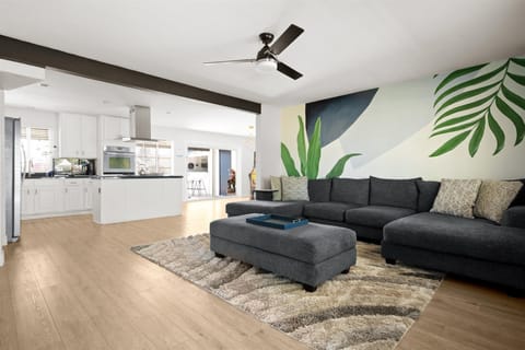 Step into our bright and open living room, perfectly adjacent to the heart of the home – the kitchen