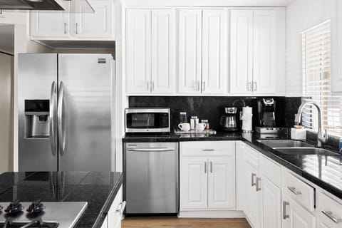 Large fridge and tons of cabinetry