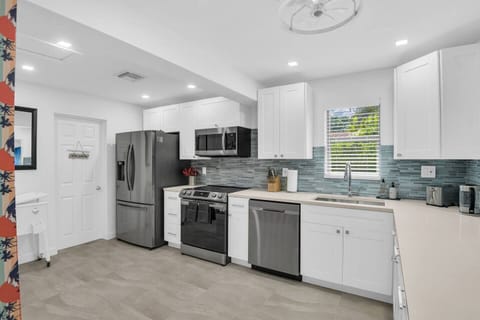 This kitchen is ready for anything, with a full suite of high-end appliances, cookware, and utensils, making it perfect for both casual meals and gourmet cooking.