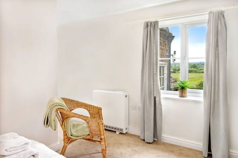 Wake up to breathtaking views over the Yorkshire countryside from the double bedroom – a perfect spot to enjoy your self-catering retreat.