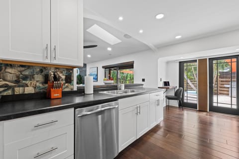 There is a dedicated work space at the far end of the kitchen