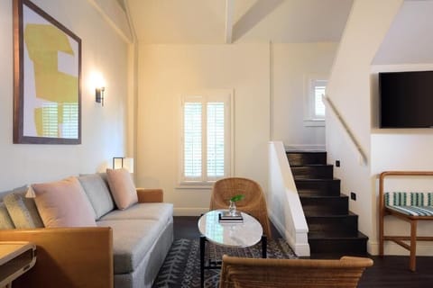 Living area. Exact unit will be assigned upon arrival. Views, colors, and decor may vary.