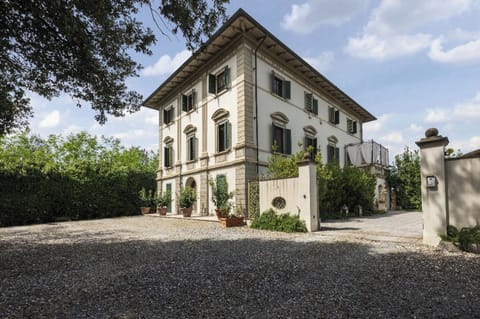 An elegant early 20th-century art nouveau villa nestled near the hills of Pisa.
