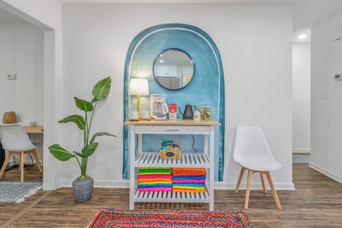 Enjoy a fresh brew from coffee maker, infront of a hand-painted mural