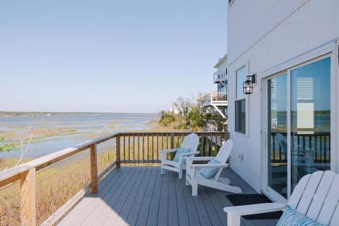Large front and back decks provide multiple outdoor living spaces for enjoying the fresh coastal air and stunning sunsets.