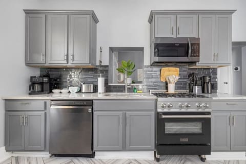 The fully equipped kitchen is ready for family meals, featuring modern appliances and plenty of counter space.