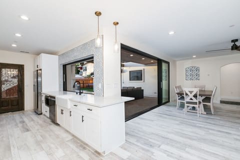 Open-concept living at its finest! This stunning kitchen features modern appliances, a spacious island, and seamless indoor-outdoor flow.