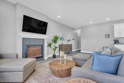Large TV above the fireplace to catch a flick when the weather isn`t cooperating