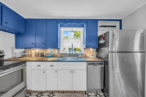 Kitchen is well stocked and features stainless steel appliances