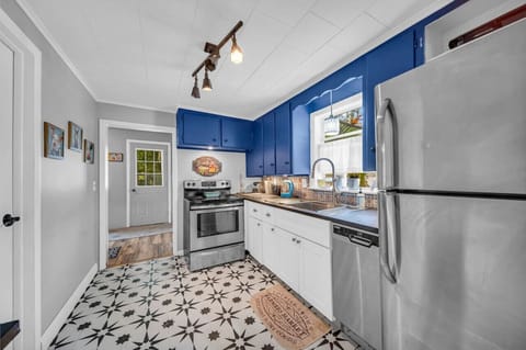 The bathroom is off of the kitchen and laundry is behind the kitchen