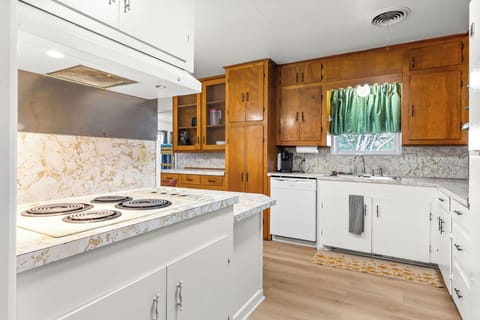 Kitchen is fitted with range, oven & dishwasher.