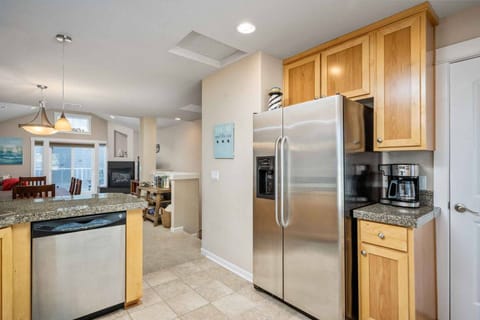 The kitchen has ample space and up to date appliances.
