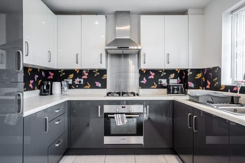 Kitchen. Fully equipped with cooking equipment perfect for families. Appliances such as fridge freezer, microwave, cooker, oven, dishwasher Toaster are free and available for your use.