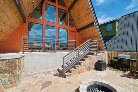 Covered patio, fire pit, and gas grill