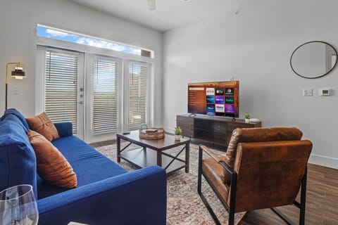 You feel at home as you settle into the living room, where the inviting atmosphere is perfect for lounging or entertaining.