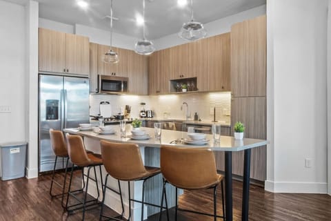 Set the table for memorable meals in this beautifully arranged dining area. With elegant place settings and a charming centerpiece, it's perfect for hosting dinner parties or enjoying family dinners in a cozy and stylish atmosphere.