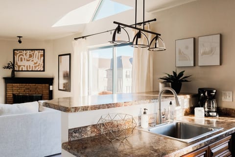 Kitchen opens to living space