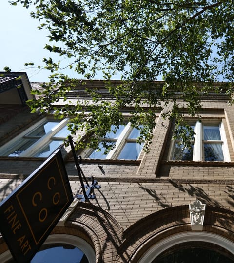 Street view of the building from the sidewalk below.