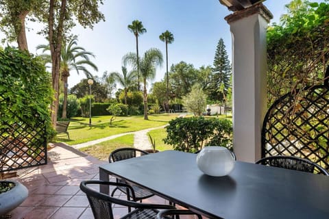 Private back yard dining area facing pool