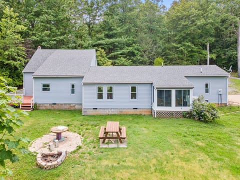 Backyard with Charcoal grill, firepit and plenty of seating.