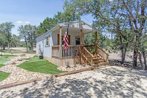 The Shooting Star Cabin is peacefully nestled in the shade on the ranch...and it's got air conditioning and heating inside, too!