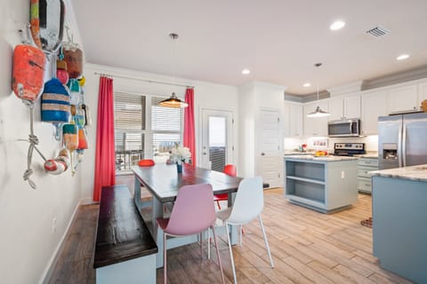 dining area with additional bar seating in kitchen