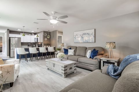 Relax in the cozy living room with plush seating and a Smart TV for your favorite shows.
